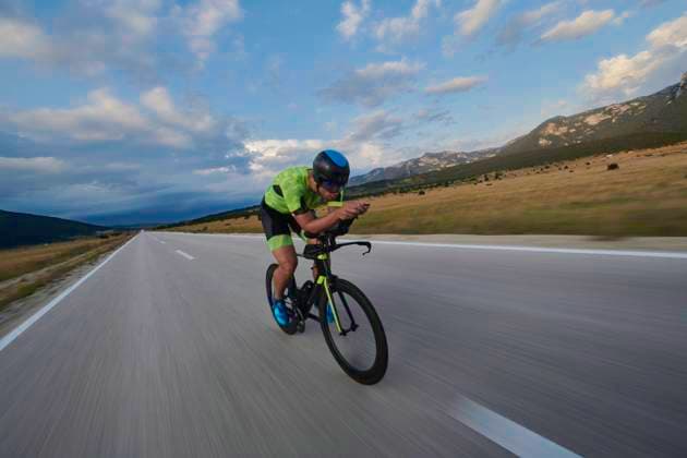 triathlon athlete riding bike triathlon athlete riding professional racing bike at workout on curvy country road (License=RF) 16107376 ,model released, Symbolfoto Copyright: xZoonar.com benisxarapovicx 16107376 ,model released, Symbolfoto ,property released