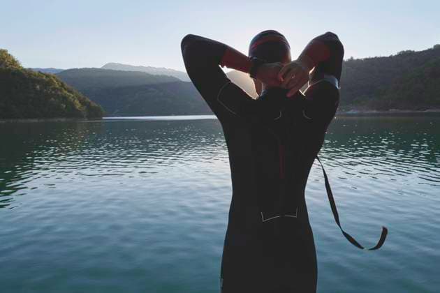 triathlon athlete starting swimming training on lake triathlon athlete start swimming training splashing water while running and jumping (License=RF) 16466369 ,model released, Symbolfoto Copyright: xZoonar.com benisxarapovicx 16466369 ,model released, Symbolfoto ,property released