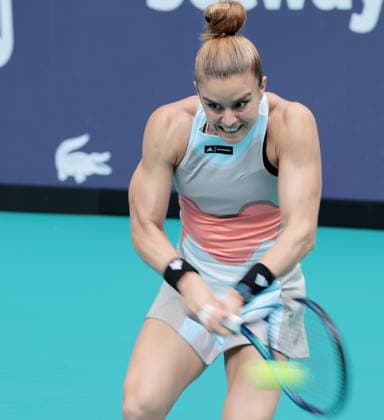 Maria Sakkara from Greece hits a backhand shot to Bianca Andreescu from Canada during day three at the Miami Open in the Hard Rock Stadium in Miami Gardens, Florida, on Friday, March 24, 2023. Andreescu defeated Sakkara 7-7,6-3,6-4.  MIA20230324103 GARYxIxROTHSTEIN
