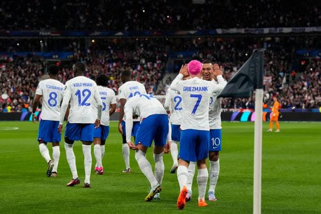 (230325) -- PARIS, March 25, 2023 -- France s Antoine Griezmann (front) celebrates his goal with Kylian Mbappe during the UEFA EURO, EM, Europameisterschaft,Fussball 2024 qualification match between France and the Netherlands in Paris, France, March 24, 2023. (Photo by Glenn Gervot Xinhua) (SP)FRANCE-PARIS-FOOTBALL-UEFA EURO 2024 QUALIFIERS-FRANCE VS NETHERLANDS GxLennGervotgaojing 