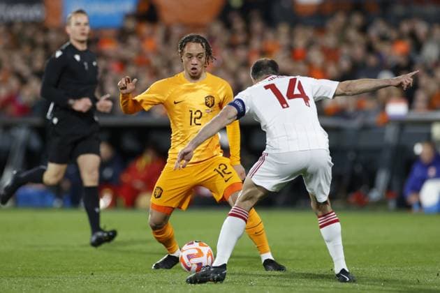 ROTTERDAM , 27-03-2023 , Stadion de Kuip , UEFA Qualification EURO 2024 , season 2022 2023 , match between Netherlands and Gibraltar , (L-R) Netherlands player Xavi Simons, Gibraltar player Roy Chipolina Netherlands - Gibraltar  x20346256x Copyright: