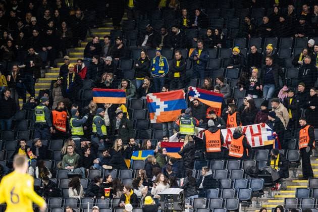 230327 Security guards in the stands with fans holding up a protest banner during the UEFA EURO, EM, Europameisterschaft,Fussball Qualifier, EM, Europameisterschaft football match between Sweden and Azerbaijan on March 27, 2023 in Stockholm. Photo: Jesper Zerman BILDBYRAN COP 234 JZ0347 bbeng football soccer fotboll fotball uefa euro qualifier landskamp emkval em-kvalifisering em-kvalik sverige sverige a sweden azerbajdzjan publik Copyright: JESPERxZERMAN BB230327JZ037