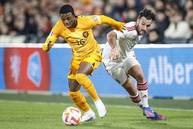 ROTTERDAM , 27-03-2023 , Stadion de Kuip , UEFA Qualification EURO 2024 , season 2022 2023 , match between Netherlands and Gibraltar , (L-R) Netherlands player Tyrell Malacia, Gibraltar player Ethan Jolley Netherlands - Gibraltar  x20346894x Copyright: