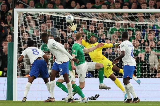 Mandatory Credit: Photo by Paul Greenwood Shutterstock (13847018z) France Goalkeeper Mike Maignan svaes the header at gaol by Nathan Collins of Republic of Ireland Republic of Ireland v France, UEFA European Championship, EM, Europameisterschaft 2024 Qualifying, Group B, Football, Aviva Stadium, Dublin, Ireland - 27 Mar 2023 EDITORIAL USE ONLY No use with unauthorised audio, video, data, fixture lists, club league logos or live services. Online in-match use limited to 120 images, no video emulation. No use in betting, games or single club league player publications. Republic of Ireland v France, UEFA European Championship 2024 Qualifying, Group B, Football, Aviva Stadium, Dublin, Ireland - 27 Mar 2023 EDITORIAL USE ONLY No use with unauthorised audio, video, data, fixture lists, club league logos or live services. Online in-match use limited to 120 images, no video emulation. No use in betting, games or single club league player publications. Copyright: xPaulxGreenwood Shutterstockx 13847018z