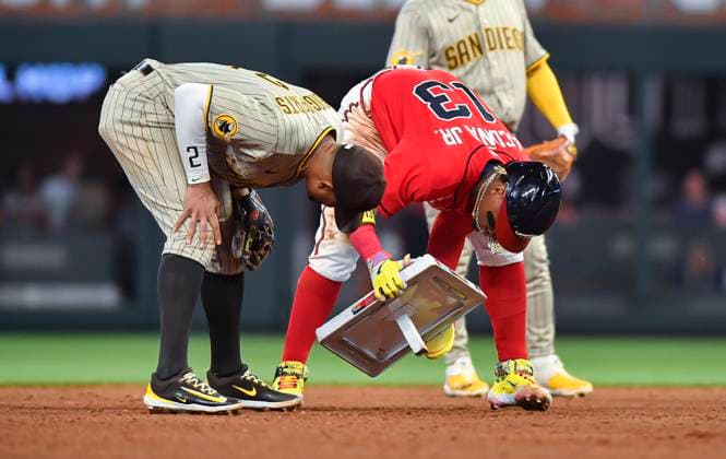 Sport Themen der Woche KW14 Sport Bilder des Tages April 07, 2023: San Diego Padres infielder Xander Bogaerts (left) and Atlanta Braves outfielder Ronald Acuna Jr. (right) try to reinsert second base back into its original place after knocking it lose during the fifth inning of a MLB, Baseball Herren, USA game at Truist Park in Atlanta, GA. Austin McAfee CSM Atlanta USA - ZUMAc04_ 20230407_zaf_c04_100 Copyright: xAustinxMcafeex