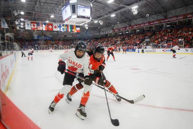 April 8, 2023, BRAMPTON, ON, CANADA: Canada forward Sarah Nurse (20) and Japan defender Ayaka Hitosato (4) chase a puck into the corner during first period IIHF WomenöÄÃ s World Hockey Championship hockey action in Brampton, Ont., on Saturday, April 5, 2023. Canada News - April 8, 2023  - ZUMAc35_ 20230408_zaf_c35_034 Copyright: xColexBurstonx