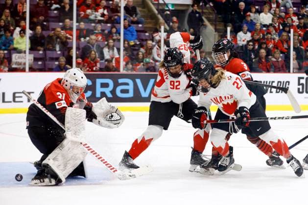 April 8, 2023, BRAMPTON, ON, CANADA: A puck slips through the legs of Japan goaltender Riko Kawaguchi (31) as Canada forward Danielle Serdachny (92), forward Emma Maltais (27) and Japan defender Aoi Shiga (3) battle in front of the net during second period IIHF Womens World Hockey Championship hockey action in Brampton, Ont., on Saturday, April 8, 2023. Canada News - April 8, 2023 - ZUMAc35_ 20230408_zaf_c35_062 Copyright: xColexBurstonx