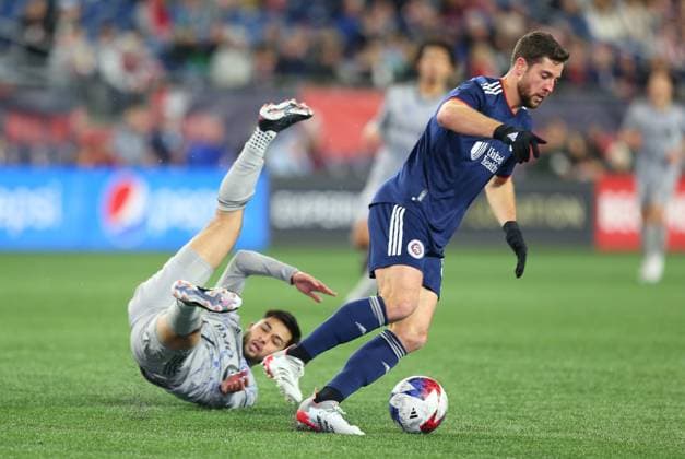 April 8, 2023; Foxborough, Massachusetts, USA; New England Revolution midfielder MATT POLSTER (8) controls the ball as CF Montreal midfielder Mathieu Choiniere stumbles during an MLS, Fussball Herren, USA match between CF Montreal and New England Revolution at Gillette Stadium in Foxborough. Foxborough USA - ZUMAc04_ 20230408_zaf_c04_076 Copyright: xAnthonyxNesmithx