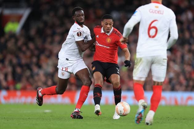 Football - UEFA Europa League - Quarter Final (1st Leg) - Manchester United, ManU v Sevilla 13th April 2023 - UEFA Europa League - Quarter Final (1st Leg) - Manchester United v Sevilla - Tanguy Nianzou of Sevilla and Anthony Martial of Manchester United - Photo: Simon Stacpoole Offside. Manchester UK Copyright: xSimonxStacpoolexOffside