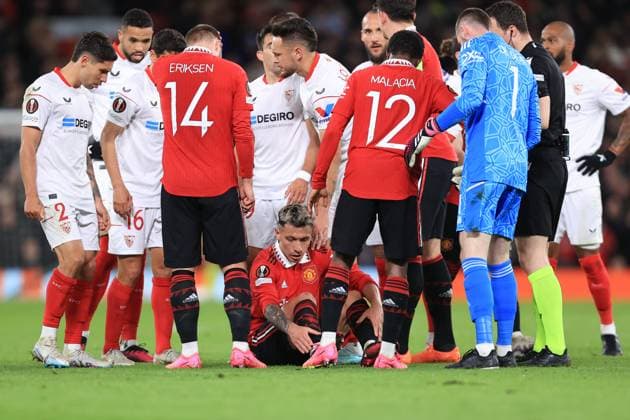 Football - UEFA Europa League - Quarter Final (1st Leg) - Manchester United, ManU v Sevilla 13th April 2023 - UEFA Europa League - Quarter Final (1st Leg) - Manchester United v Sevilla - Lisandro Martinez of Manchester United goes down injured before being taken off the pitch - Photo: Simon Stacpoole Offside. Manchester UK Copyright: xSimonxStacpoolexOffside