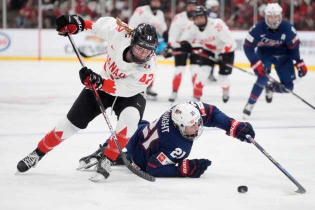 April 16, 2023, Brampton, ON, CANADA: USA forward Hilary Knight (21) battles for the puck from the ice surface against Canada defender Claire Thompson (42) during first period IHF Women s World Hockey Championship hockey action in Brampton, Ont., on Sunday, April 16, 2023. Canada News - April 16, 2023  - ZUMAc35_ 20230416_zaf_c35_081 Copyright: xFrankxGunnx