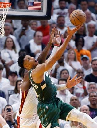 Milwaukee Bucks forward Giannis Antetokounmpo (R) tries to shoot against Miami Heat center Bam Adebayo (L) during the second half of the NBA, Basketball Herren, USA basketball playoff game three between the Miami Heat and the Milwaukee Bucks at the Kaseya Center in Miami, Florida, USA, 24 April 2023. NBA Playoffs Milwaukee Bucks at Miami Heat !ACHTUNG: NUR REDAKTIONELLE NUTZUNG!  Copyright: xRHONAxWISEx AME4136 20230425-881416d92bdc5ba8b4dd7fabfcc8fc825391bea6