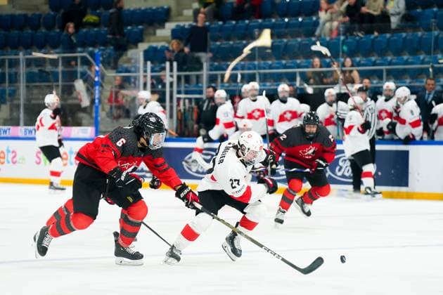 27.04.2023, Basel, St. Jakob Arena, IIHF Ice hockey, Eishockey U18 World Championship, WM, Weltmeisterschaft Canada vs Switzerland, 27 Simon Meier (Switzerland) against 6 Andrew Gibson (Canada) Basel St. Jakob Arena Basel Switzerland Copyright: xJustPictures.ch DanielaxPorcellix