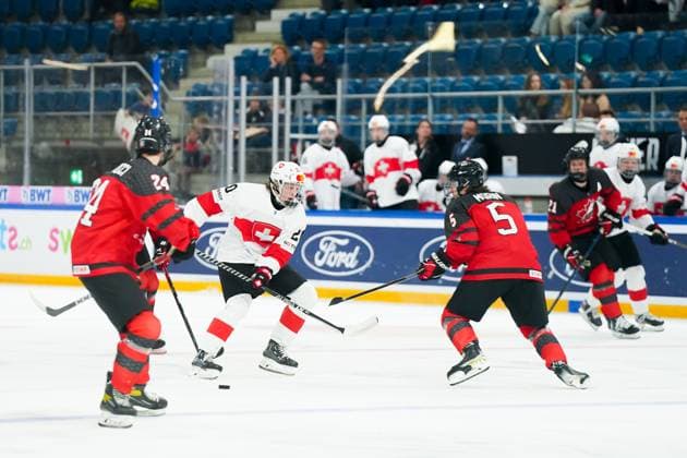 27.04.2023, Basel, St. Jakob Arena, IIHF Ice hockey, Eishockey U18 World Championship, WM, Weltmeisterschaft Canada vs Switzerland, 20 Matteo Wagner (Switzerland) against 5 Etienne Morin (Canada) Basel St. Jakob Arena Basel Switzerland Copyright: xJustPictures.ch DanielaxPorcellix