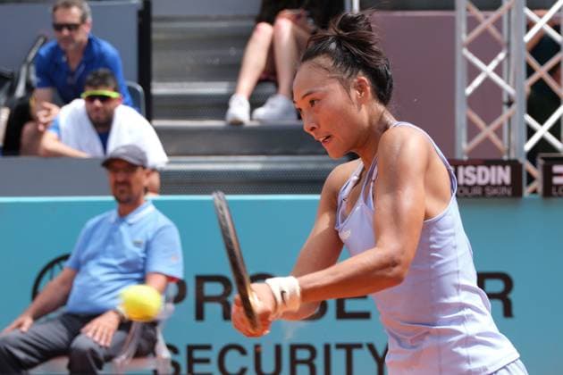 (230428) -- MADRID, April 28, 2023 -- Zheng Qinwen of China competes during the women s singles round of 64 match against Caty McNally of the United States at the Madrid Open tennis tournament in Madrid, Spain, April 28, 2023. ) (SP)SPAIN-MADRID-TENNIS-MADRID OPEN-WOMEN S SINGLES MengxDingbo 