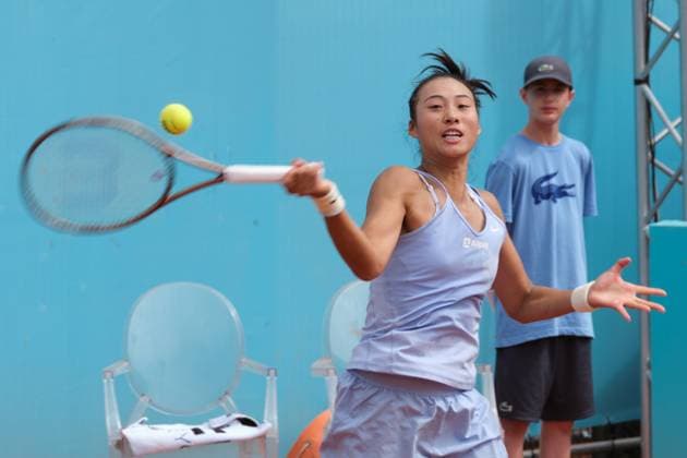 (230428) -- MADRID, April 28, 2023 -- Zheng Qinwen of China competes during the women s singles round of 64 match against Caty McNally of the United States at the Madrid Open tennis tournament in Madrid, Spain, April 28, 2023. ) (SP)SPAIN-MADRID-TENNIS-MADRID OPEN-WOMEN S SINGLES MengxDingbo 