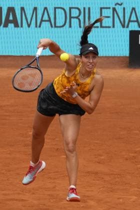 Jessica Pegula serves a shot to Magdalena Frech of Poland during their second round match on day five of the Mutua Madrid Open at the Caja Magica stadium, in Madrid, Spain, on Friday, April 28, 2023.  PDH20230428052 PaulxHanna