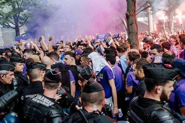 Toulouse fans arrive near the stadium and wait to go through security checks. The club s Ultras have smoke bombs. Tens of thousands of Nantes and Toulouse fans went to the Stade de France to watch the French Cup final. Some activists were handing out red armbands and whistles following a decision by the administrative court to overturn a decision by the Paris prefecture to ban protest rallies.  JanxSchmidt-Whitley LexPictorium LePictorium_0279998