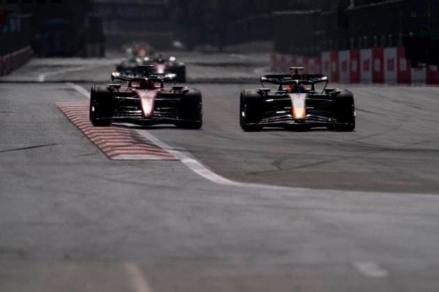April 30, 2023, Baku, Azerbaijan: SERGIO PEREZ of Mexico and Red Bull Racing overtakes CHARLES LECLERC of Monaco and Scuderia Ferrari during the 2023 FIA Formula 1 Azerbaijan Grand Prix at Baku City Circuit in Baku, Azerbaijan. Baku Azerbaijan - ZUMAg147 20230430_zap_g147_036 Copyright: xJamesxGasperottix