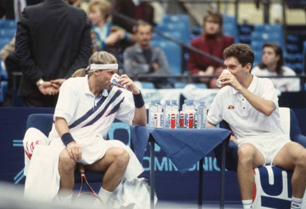 Moscow, Russia. Swedish tennis player Bjoern Borg and Russian player Andrei Cherkasov (L-R front) have a break during the match against American player Jared Palmer and Norwegian player Bent-Ove Pedersen in the first round of the men s doubles event during the 1993 Kremlin Cup tennis tournament at the Olympic Sports Complex. Russian and Swedish players lost the match. Robert Maximov TASS  58380824