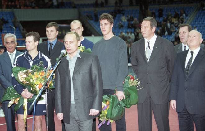 Moscow, Russia. Chairman of the Government of the Russian Federation Vladimir Putin (front), tournamnet founder, Swiss businessman Sasson Khakshouri, tennis player from Zimbabwe Byron Black (second place in the single event) (L-R back), Ukrainian and Russian tennis players Andrei Medvedev (4th L back) and Marat Safin (3rd R back) (second place in men s doubles event), Chairman of the Council of Directors of the tournament, Preident of the Tennis Federation of Russia Shamil Tarpishchev (2nd R back) and Moscow Mayor Yuri Luzhkov (R) participate in the award ceremony of the 1999 Kremlin Cup at the Olympic Sports Complex. Robert Maximov TASS  58384010