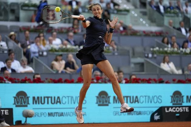 Petra Martic of Croatia returns a shot to Iga Swiatek of Poland during their quarter final match on day 8 of the Mutua Madrid Open at the Caja Magica stadium, in Madrid, Spain, on Wednesday, May 3, 2023.  PDH20230503109 PaulxHanna
