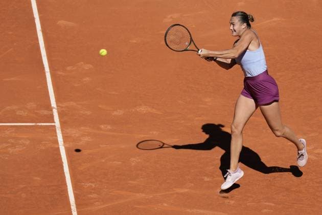 Aryna Sabalenka of Belarus returns a shot to Maria Sakkari of Greece during their semi-final match of the Mutua Madrid Open at the Caja Magica stadium, in Madrid, Spain, on Thursday, May 4, 2023.  PDH20230504057 PaulxHanna