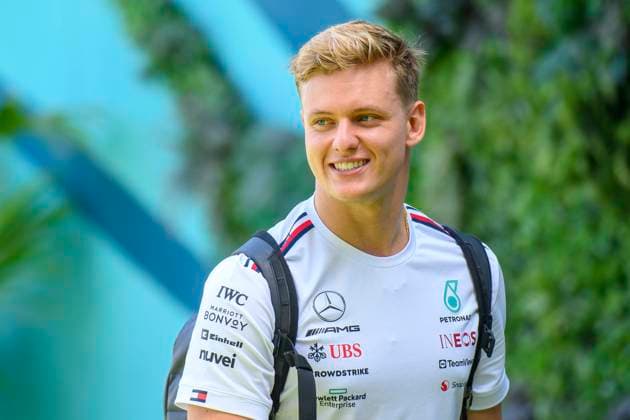 5th May 2023: Miami International Autodrome, Miami Gardens, Florida, USA: Formula 1 Crypto.com Miami Grand Prix 2023: Free Practice Day: Mercedes AMG reserve driver Mick Schumacher smiles he arrives at the Paddock.  ActionPlus12505129 DouglasxMurray