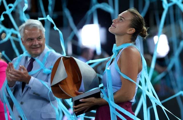 Mandatory Credit: Photo by Ella Ling Shutterstock (13895885e) Aryna Sabalenka of Belarus celebrates with the trophy under the blue streamer Mutua Madrid Open, Day 13, Tennis, La Caja Magica, Madrid, Spain - 06 May 2023 Mutua Madrid Open, Day 13, Tennis, La Caja Magica, Madrid, Spain - 06 May 2023 Copyright: xEllaxLing Shutterstockx 13895885e