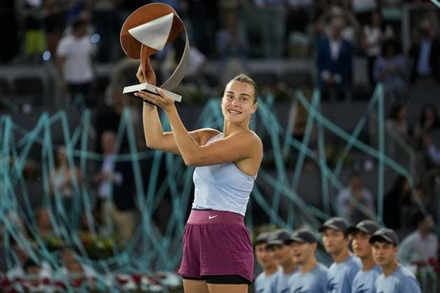 Aryna Sabalenka of Belarus holds her trophy on the podium after winning the 2023 Mutua Madrid Open against Iga Swiatek of Poland at the Caja Magica stadium, in Madrid, Spain, on Saturday, May 6, 2023.  PDH20230506014 PaulxHanna