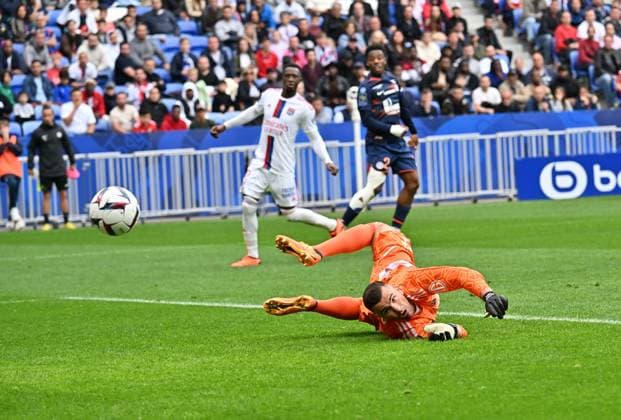 Anthony Lopes et Sinaly Diomende (lyon) vs Christ Maouassa (montpellier) FOOTBALL: Olympique Lyonnais vs Montpellier HÃ rault Club - Ligue 1 - 07 05 2023 FredericChambert Panoramic 