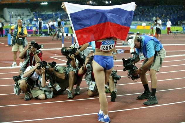 Athens, Greece. Russian athlete Yelena Isinbayeva wins the gold medal in pole vault event with the record result of 4,91 metres during the 2004 Summer Olympics at the Spyros Louis Olympic Stadium. Robert Maximov TASS  58846297