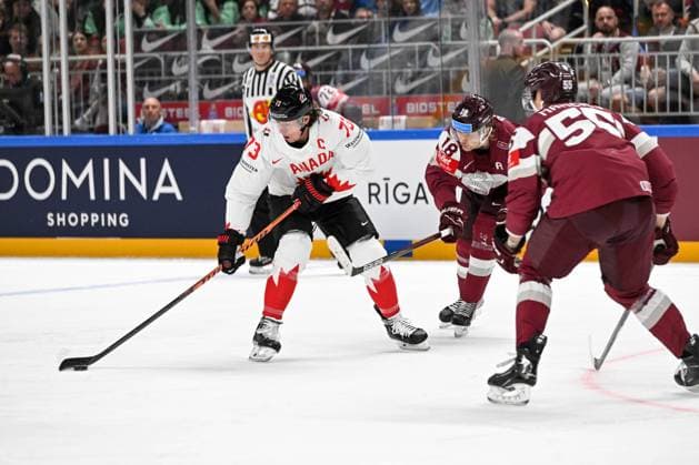 RIGA, LATVIA - MAY 12: Tyler Toffoli of Canada (L) controls the puck against Rodrigo Abols (R) of Latvia during the 2023 IIHF Ice hockey, Eishockey World Championship, WM, Weltmeisterschaft Finland - Latvia game between Latvia and Canada at Arena Riga on May 12, 2023 in Riga, Latvia. Riga Arena Riga Latvia Copyright: xJustPictures.ch AndreaxBrancax