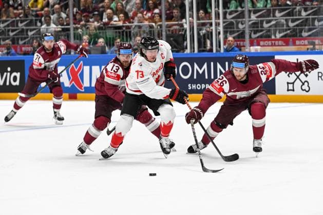 RIGA, LATVIA - MAY 12: Tyler Toffoli of Canada fights for the puck against Rihards Bukarts of Latvia (L) and Uvis Janis Balinskis of Latvia (R) during the 2023 IIHF Ice hockey, Eishockey World Championship, WM, Weltmeisterschaft Finland - Latvia game between Latvia and Canada at Arena Riga on May 12, 2023 in Riga, Latvia. Riga Arena Riga Latvia Copyright: xJustPictures.ch AndreaxBrancax