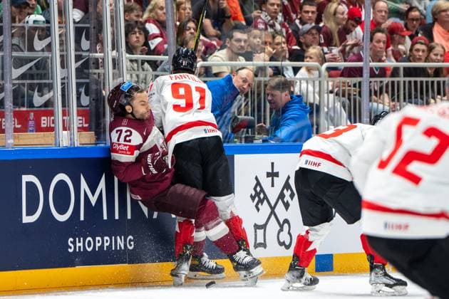 RIGA, LATVIA - MAY 12: Adam Fantilli of Canada (R) hit on Janis Jaks of Latvia (L) during the 2023 IIHF Ice hockey, Eishockey World Championship, WM, Weltmeisterschaft Finland - Latvia game between Latvia and Canada at Arena Riga on May 12, 2023 in Riga, Latvia. Riga Arena Riga Latvia Copyright: xJustPictures.ch JarixPestelaccix