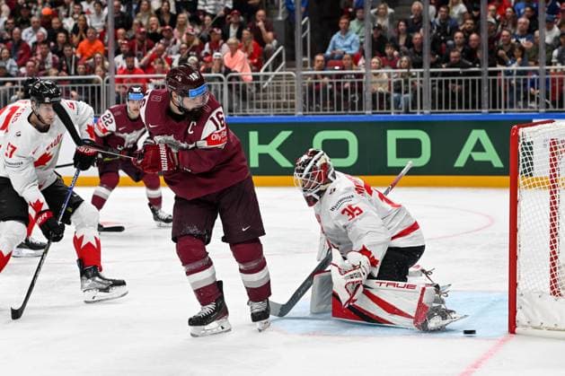 RIGA, LATVIA - MAY 12: Kaspars Daugavins of Latvia tries to deflect the puck against goalkeeper Samuel Montembeault of Canada during the 2023 IIHF Ice hockey, Eishockey World Championship, WM, Weltmeisterschaft Finland - Latvia game between Latvia and Canada at Arena Riga on May 12, 2023 in Riga, Latvia. Riga Arena Riga Latvia Copyright: xJustPictures.ch AndreaxBrancax