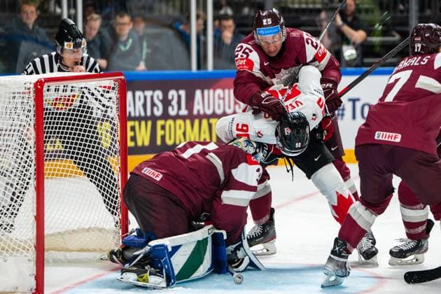 RIGA, LATVIA - MAY 12: Andris Dzerins of Latvia (C behind) defending goalkeeper Arturs Silovs of Latvia (L) from Joe Veleno of Canada (C in front) during the 2023 IIHF Ice hockey, Eishockey World Championship, WM, Weltmeisterschaft Finland - Latvia game between Latvia and Canada at Arena Riga on May 12, 2023 in Riga, Latvia. Riga Arena Riga Latvia Copyright: xJustPictures.ch JarixPestelaccix