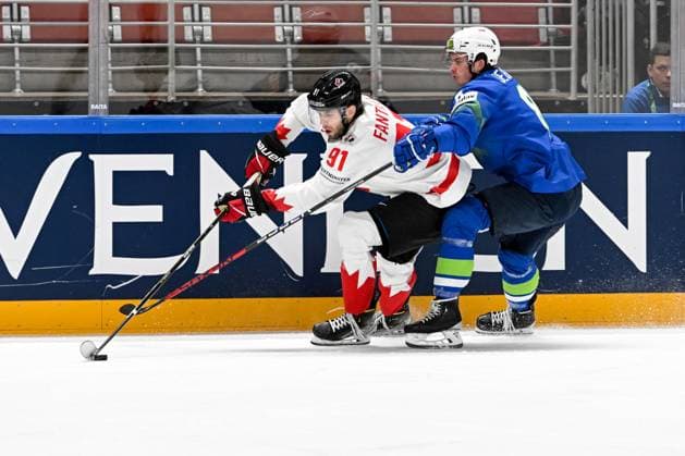 RIGA, LATVIA - MAY 14: Adam Fantilli of Canada protects the puck against Ziga Jeglic of Slovenia during the 2023 IIHF Ice hockey, Eishockey World Championship, WM, Weltmeisterschaft Finland - Latvia game between Slovenia and Canada at Arena Riga on May 14, 2023 in Riga, Latvia. Riga Arena Riga Latvia Copyright: xJustPictures.ch AndreaxBrancax