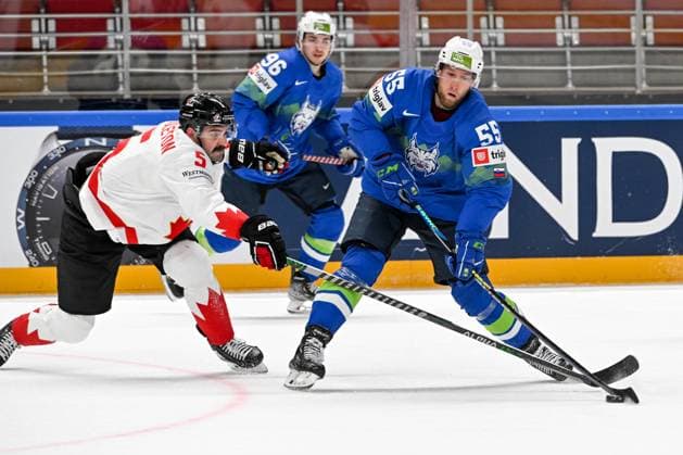 RIGA, LATVIA - MAY 14: Robert Sabolic of Slovenia shots the puck against Jacob Middleton of Canada during the 2023 IIHF Ice hockey, Eishockey World Championship, WM, Weltmeisterschaft Finland - Latvia game between Slovenia and Canada at Arena Riga on May 14, 2023 in Riga, Latvia. Riga Arena Riga Latvia Copyright: xJustPictures.ch AndreaxBrancax