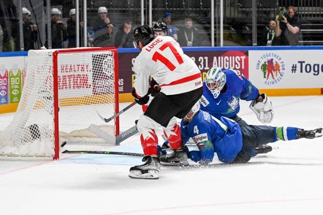 RIGA, LATVIA - MAY 14: Aleksandar Magovac of Slovenia saves the puck against Milan Lucic of Canada during the 2023 IIHF Ice hockey, Eishockey World Championship, WM, Weltmeisterschaft Finland - Latvia game between Slovenia and Canada at Arena Riga on May 14, 2023 in Riga, Latvia. Riga Arena Riga Latvia Copyright: xJustPictures.ch AndreaxBrancax