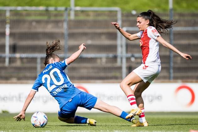 FLYERALARM. Frauen Fussball Bundesliga, 1. FC Koeln - SV Meppen 1912 e.V. Julia Pollak (SV Meppen 1912 e.V., 20), Manjou Wilde (1. FC Koeln, 7) FLYERALARM Frauen Fussball Bundesliga, 1. FC Koeln - SV Meppen 1912 e.V., Koeln, Geissbockheim am 14.05.2023 DFB REGULATIONS PROHIBIT ANY USE OF PHOTOGRAPHS AS IMAGE SEQUENCES AND OR QUASI-VIDEO. Copyright: xBEAUTIFULxSPORTS Wunderlx