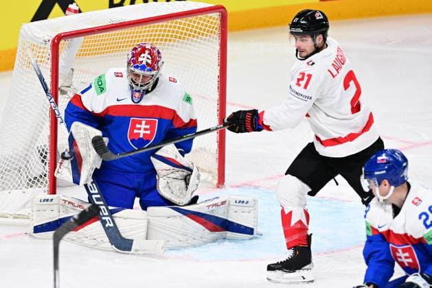 L-R goalkeeper Samuel Hlavaj (SVK) and Scott Laughton (CAN) in action during the IIHF Ice hockey, Eishockey World Championship, WM, Weltmeisterschaft Group B match Slovakia vs Canada, on May 15, 2023, in Riga, Latvia. (CTKxPhoto DavidxTanecek) CTKPhotoP2023051505092  CTKPhotoP2023051505092