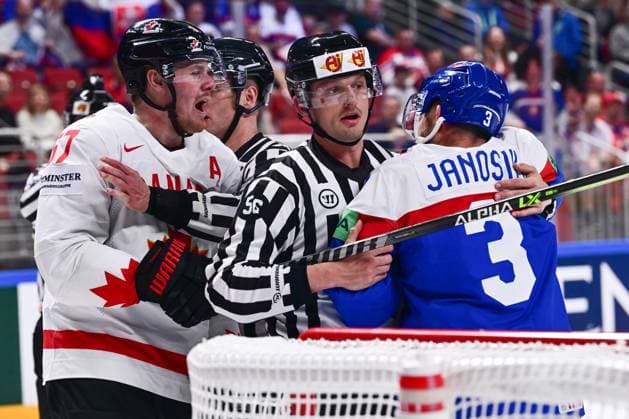 L-R Lawson Crouse (CAN), referees and Adam Janosi (CZE) in skirmish during the IIHF Ice hockey, Eishockey World Championship, WM, Weltmeisterschaft Group B match Slovakia vs Canada, on May 15, 2023, in Riga, Latvia. (CTKxPhoto DavidxTanecek) CTKPhotoP2023051505964  CTKPhotoP2023051505964