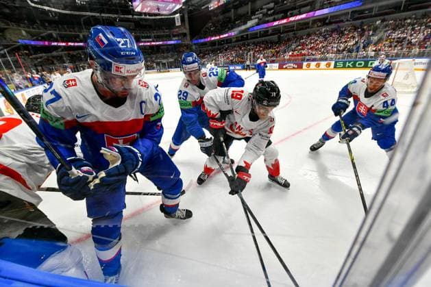 RIGA, LATVIA - MAY 15: Peyton Krebs of Canada fights for the puck against Marek Hrivik of Slovakia, Michal Ivan of Slovakia and Mislav Rosandic of Slovakia during the 2023 IIHF Ice hockey, Eishockey World Championship, WM, Weltmeisterschaft Finland - Latvia game between Slovakia and Canada at Arena Riga on May 15, 2023 in Riga, Latvia. Riga Arena Riga Latvia Copyright: xJustPictures.ch AndreaxBrancax