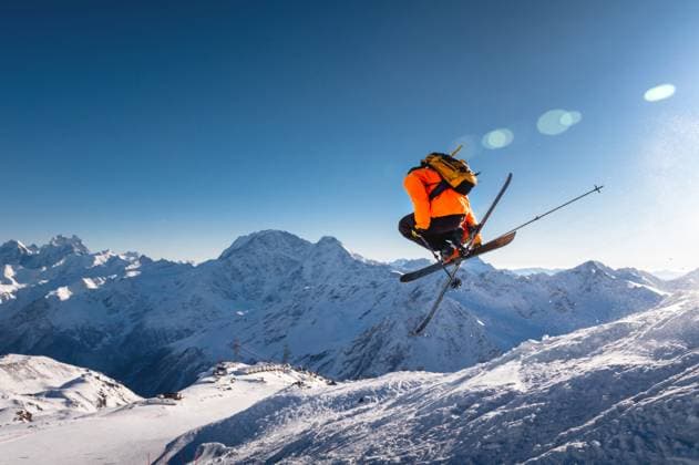 The skier jumps on the background of the blue sky and snow-capped mountains. freestyle skier performs helicopter with crossed skis simultaneously with full rotation The skier jumps on the background of the blue sky and snow-capped mountains. freestyle skier performs helicopter with crossed skis simultaneously with full rotation. (License=RF) 19933111 ,model released, Symbolfoto Copyright: xZoonar.com IanxIankovskiix 19933111 ,model released, Symbolfoto ,property released