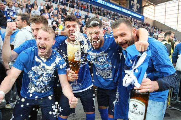 19.05.2023, xtvx, Fussball 2.Bundesliga, SV Darmstadt 98 - 1.FC Magdeburg emspor, emonline, v.l. nach dem Spiel, after the match Jubel Fabian Holland (SV Darmstadt 98) Mathias Honsak (SV Darmstadt 98) Emir Karic (SV Darmstadt 98) (DFL DFB REGULATIONS PROHIBIT ANY USE OF PHOTOGRAPHS as IMAGE SEQUENCES and or QUASI-VIDEO) Darmstadt