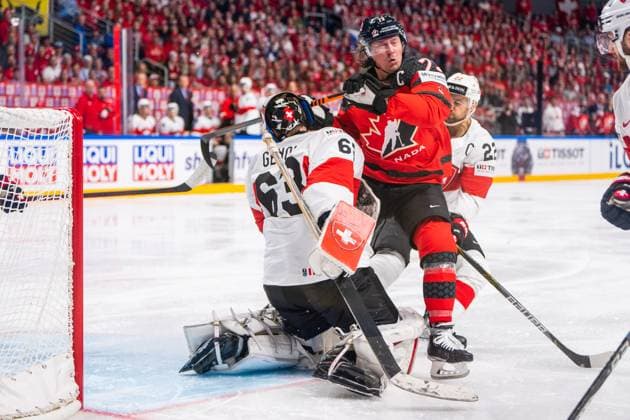 RIGA, LATVIA - MAY 20: Tyler Toffoli of Canada (C) pushed by Nino Niederreiter of Switzerland (behind<9 on goalkeeper Leonardo Genoni of Switzerland (L) during the 2023 IIHF Ice hockey, Eishockey World Championship, WM, Weltmeisterschaft Finland - Latvia game between Canada Switzerland at Arena Riga on May 20, 2023 in Riga, Latvia. Riga Arena Riga Latvia Copyright: xJustPictures.ch JarixPestelaccix