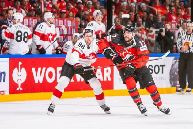 RIGA, LATVIA - MAY 20: Janis Moser of Switzerland (L) against Milan Lucic of Canada (R) during the 2023 IIHF Ice hockey, Eishockey World Championship, WM, Weltmeisterschaft Finland - Latvia game between Canada Switzerland at Arena Riga on May 20, 2023 in Riga, Latvia. Riga Arena Riga Latvia Copyright: xJustPictures.ch JarixPestelaccix