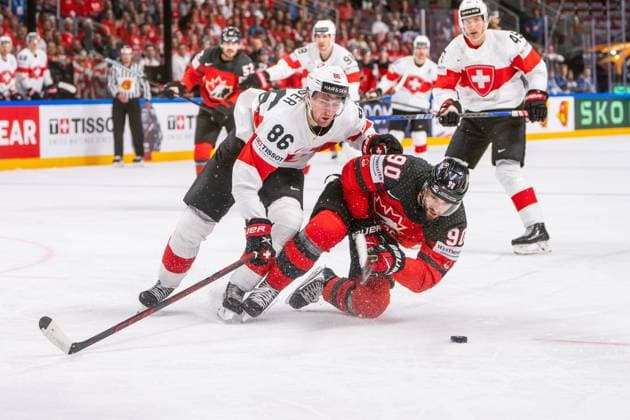 Sport Bilder des Tages RIGA, LATVIA - MAY 20: Janis Moser of Switzerland (L) against Joe Veleno of Canada (R) during the 2023 IIHF Ice hockey, Eishockey World Championship, WM, Weltmeisterschaft Finland - Latvia game between Canada Switzerland at Arena Riga on May 20, 2023 in Riga, Latvia. Riga Arena Riga Latvia Copyright: xJustPictures.ch JarixPestelaccix