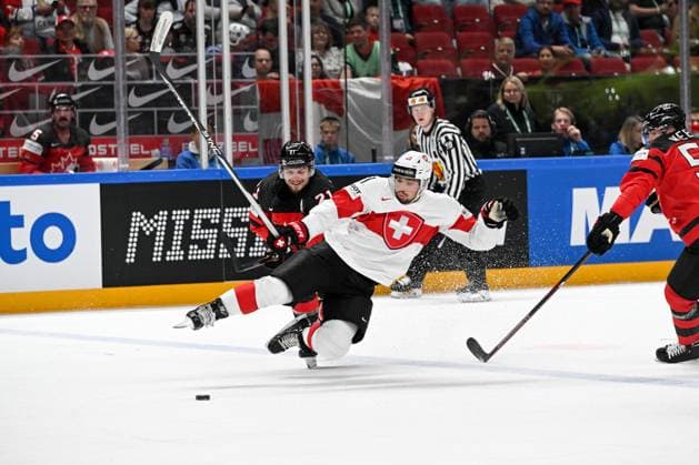 RIGA, LATVIA - MAY 20: Kevin Fiala of Switzerland battles for the puck against Scott Laughton of Canada during the 2023 IIHF Ice hockey, Eishockey World Championship, WM, Weltmeisterschaft Finland - Latvia game between Canada Switzerland at Arena Riga on May 20, 2023 in Riga, Latvia. Riga Arena Riga Latvia Copyright: xJustPictures.ch AndreaxBrancax